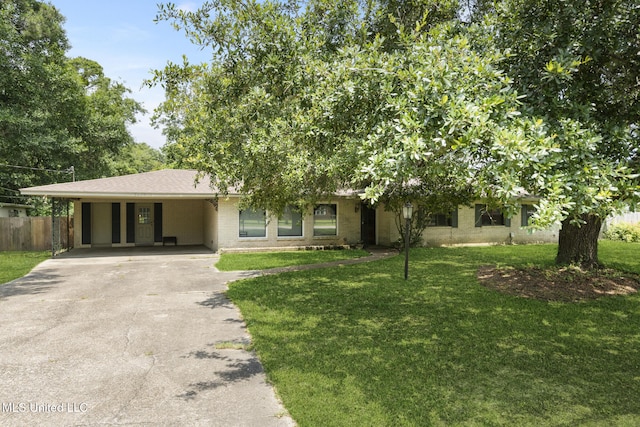 5539 Gates Ave, Long Beach, MS 39560 - view of front of home featuring driveway, a carport, and brick siding