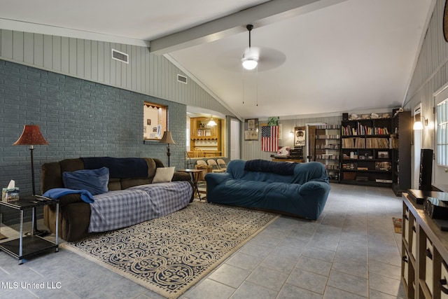 5539 Gates Ave, Long Beach, MS 39560 - living area featuring tile patterned floors, a ceiling fan, and wood walls