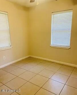 3908 Wildwood Rd, Moss Point, MS 39562 - spare room featuring light tile patterned flooring and ceiling fan