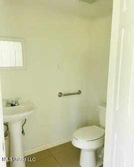 3908 Wildwood Rd, Moss Point, MS 39562 - bathroom featuring tile patterned floors and toilet