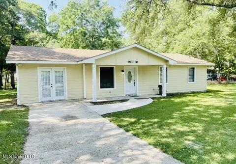 3908 Wildwood Rd, Moss Point, MS 39562 - view of front of home featuring a front lawn, french doors, and a porch