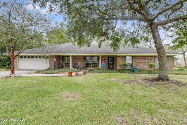 ranch-style home featuring a garage and a front lawn