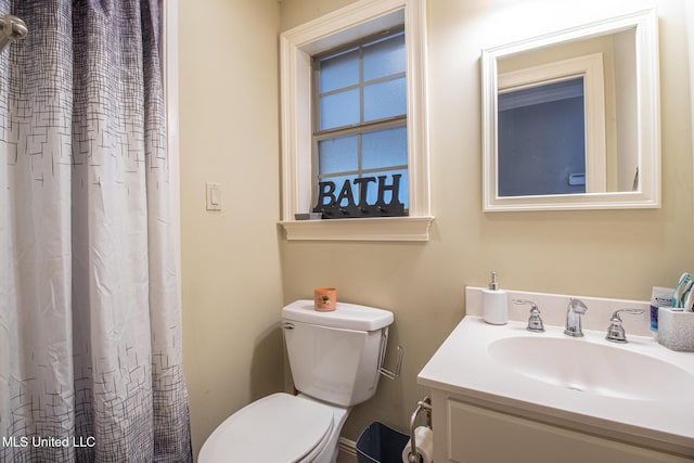 bathroom featuring vanity and toilet