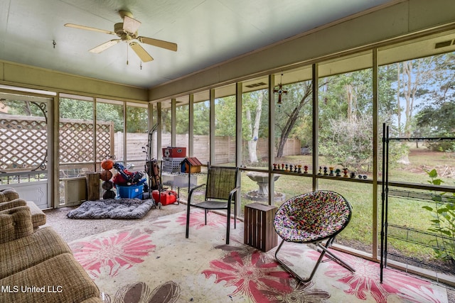 sunroom featuring a wealth of natural light and ceiling fan