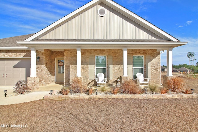 view of front of property with a garage and covered porch