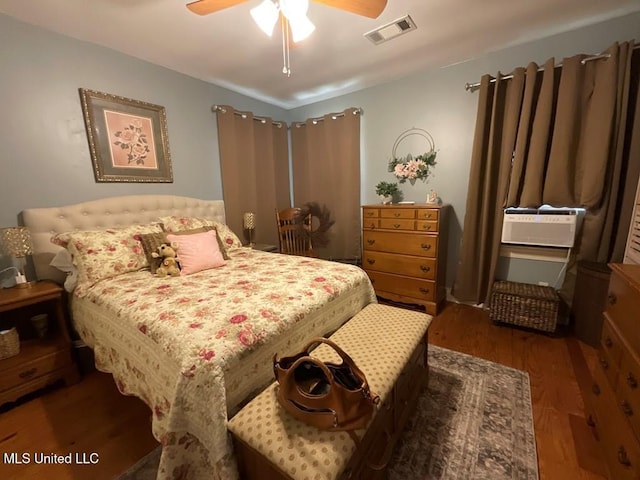 bedroom featuring ceiling fan and dark hardwood / wood-style flooring