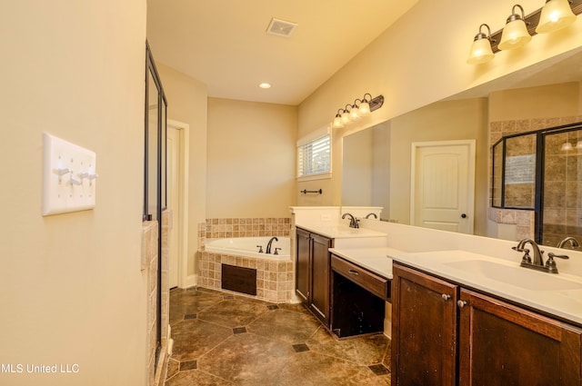 bathroom featuring vanity and separate shower and tub