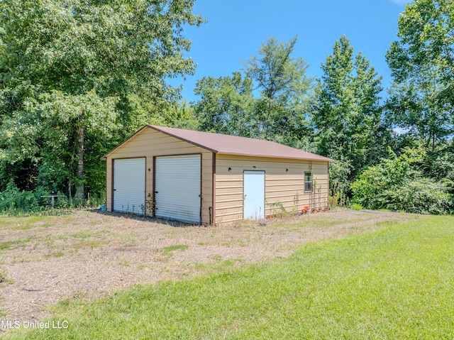 garage with a yard