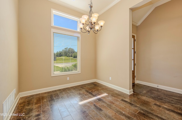 spare room featuring crown molding, dark hardwood / wood-style floors, and a chandelier