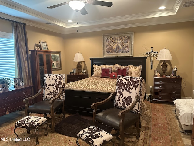 6819 Hawks Vw, Olive Branch, MS 38654 - bedroom with ornamental molding, wood finished floors, a raised ceiling, and ceiling fan