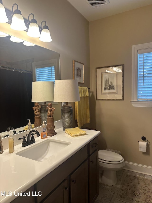 6819 Hawks Vw, Olive Branch, MS 38654 - bathroom with vanity, toilet, and baseboards