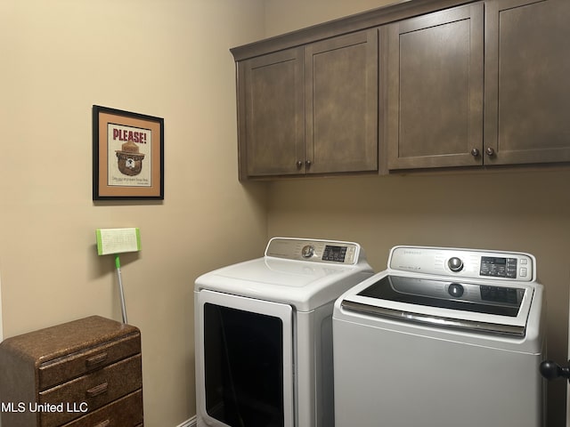 6819 Hawks Vw, Olive Branch, MS 38654 - laundry area featuring separate washer and dryer and cabinet space