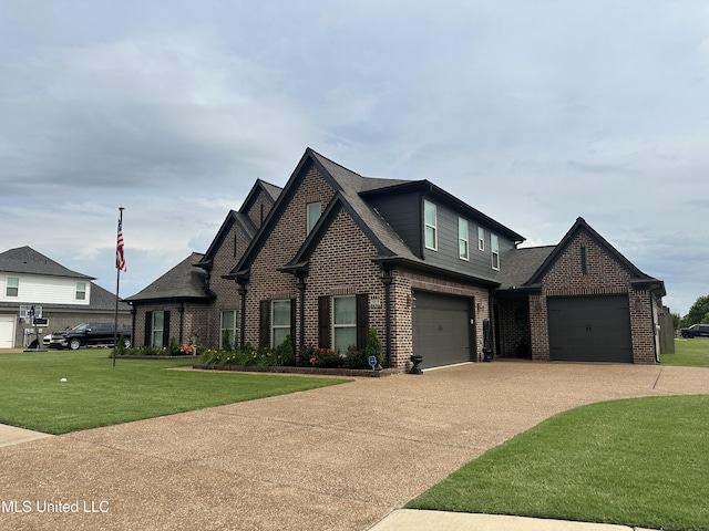 6819 Hawks Vw, Olive Branch, MS 38654 - view of front facade with brick siding, concrete driveway, a front lawn, and roof with shingles