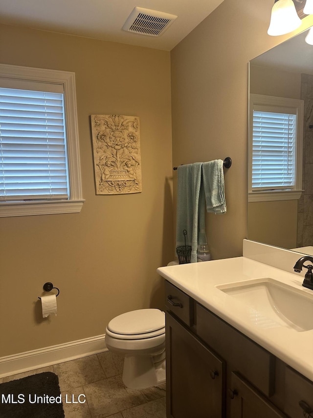 6819 Hawks Vw, Olive Branch, MS 38654 - bathroom featuring toilet, vanity, tile patterned flooring, and baseboards