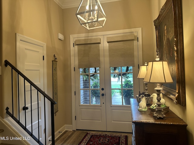 6819 Hawks Vw, Olive Branch, MS 38654 - foyer featuring a chandelier, french doors, crown molding, dark wood-style flooring, and baseboards