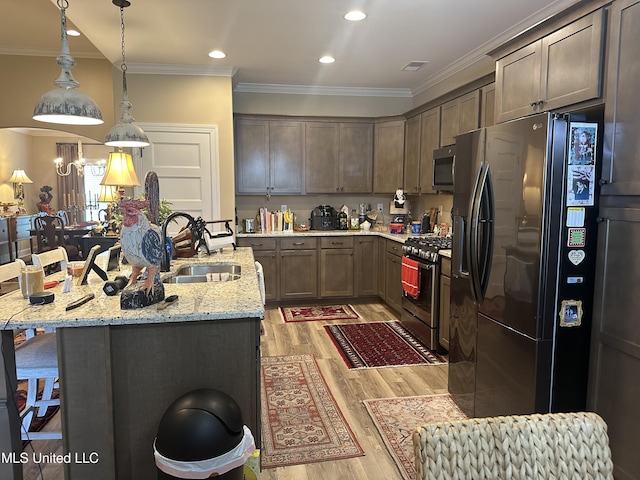 6819 Hawks Vw, Olive Branch, MS 38654 - kitchen with stainless steel appliances, a sink, light wood-type flooring, crown molding, and light stone counters