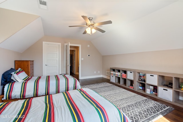 bedroom with vaulted ceiling, ceiling fan, visible vents, and wood finished floors