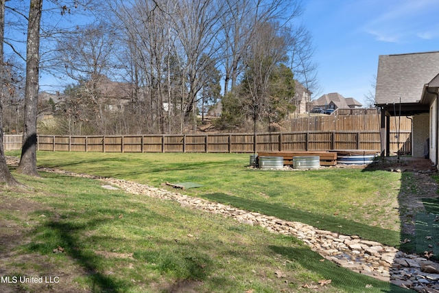 view of yard featuring a fenced backyard