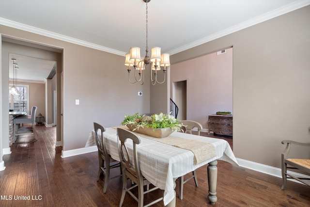 dining area with an inviting chandelier, dark wood-style floors, baseboards, and ornamental molding