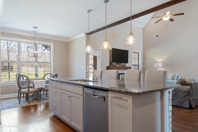 kitchen with dark wood-style flooring, ornamental molding, a sink, dishwasher, and open floor plan