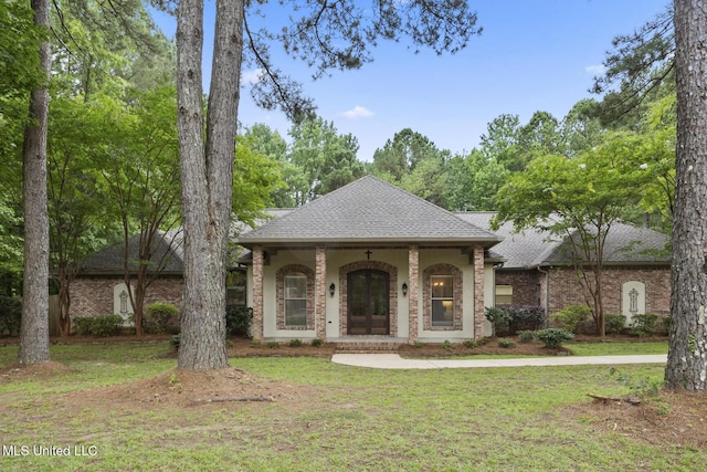 191 N Brandon Blvd, Brandon, MS 39042 - view of front facade featuring a front lawn, roof with shingles, french doors, and brick siding