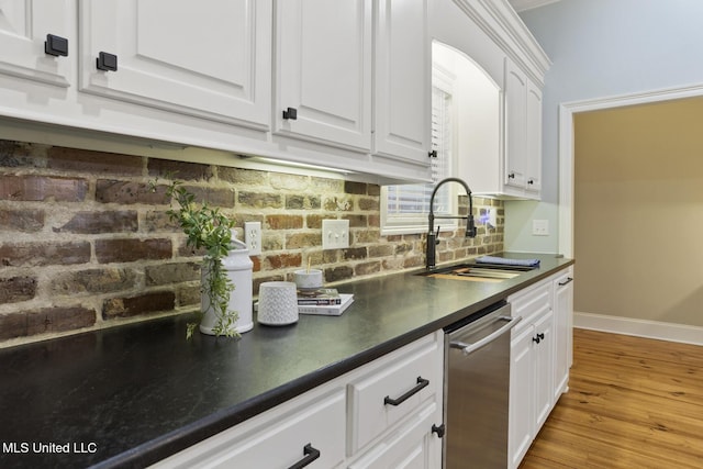 191 N Brandon Blvd, Brandon, MS 39042 - kitchen with stainless steel dishwasher, dark countertops, white cabinetry, and light wood finished floors