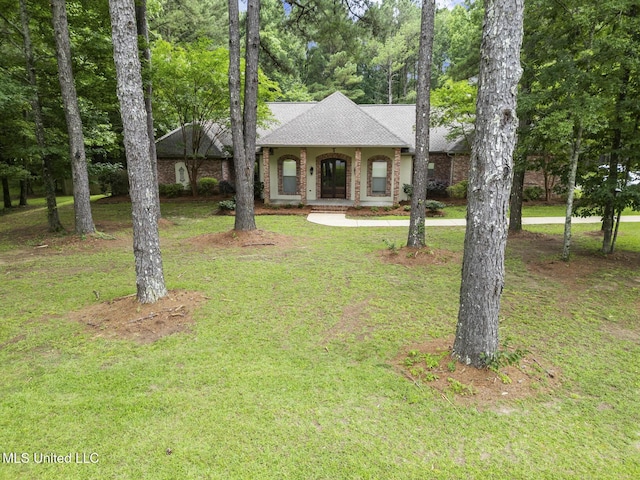 191 N Brandon Blvd, Brandon, MS 39042 - view of front of home with a front yard, roof with shingles, and brick siding