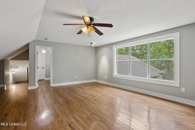 191 N Brandon Blvd, Brandon, MS 39042 - unfurnished living room with wood finished floors, ceiling fan, and vaulted ceiling