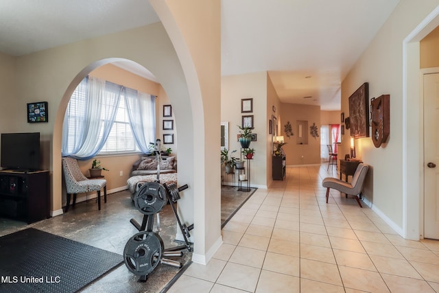 entryway featuring light tile patterned floors and baseboards