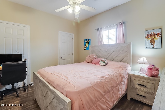 bedroom featuring ceiling fan and dark wood-style flooring