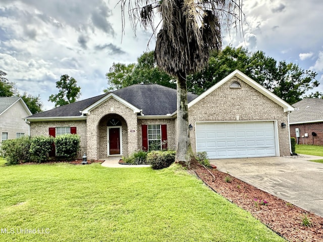 6901 N Rue Mornay, Biloxi, MS 39532 - ranch-style home featuring brick siding, driveway, a garage, and a front yard