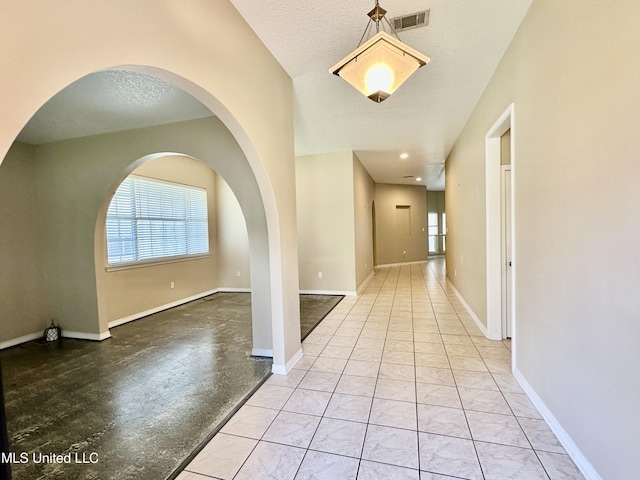 6901 N Rue Mornay, Biloxi, MS 39532 - hallway with baseboards and arched walkways