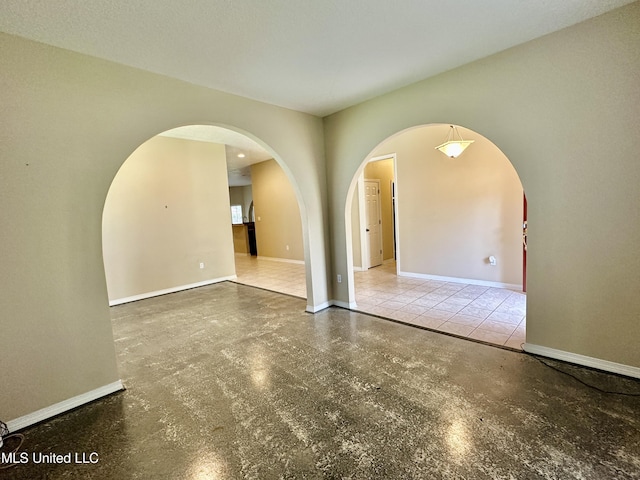 6901 N Rue Mornay, Biloxi, MS 39532 - unfurnished room featuring arched walkways and baseboards