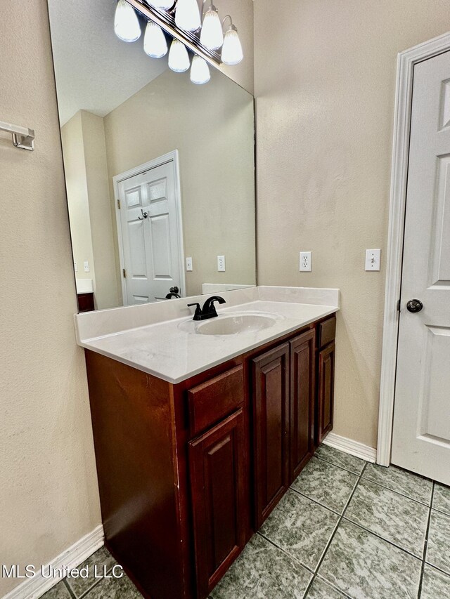 6901 N Rue Mornay, Biloxi, MS 39532 - bathroom featuring vanity and tile patterned flooring