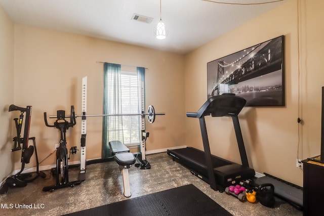 exercise area with visible vents and baseboards