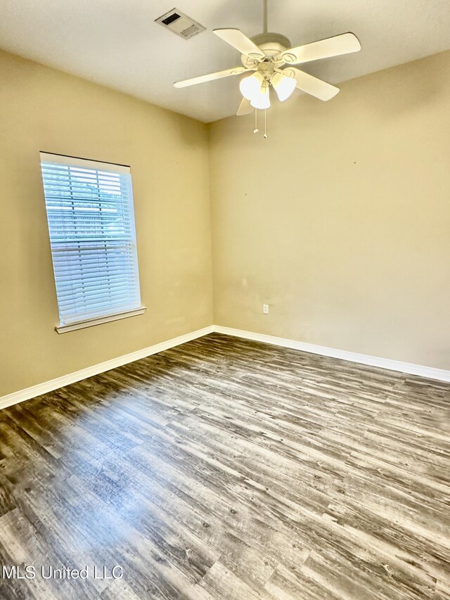 6901 N Rue Mornay, Biloxi, MS 39532 - spare room with wood finished floors and a ceiling fan
