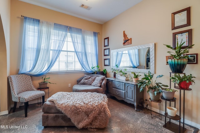 sitting room featuring visible vents and baseboards