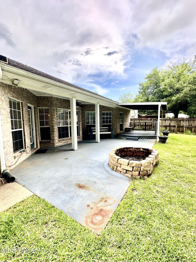 6901 N Rue Mornay, Biloxi, MS 39532 - view of yard featuring an outdoor fire pit and a patio