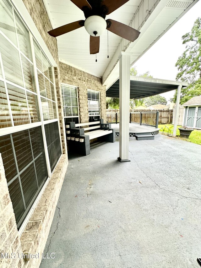 6901 N Rue Mornay, Biloxi, MS 39532 - view of patio with ceiling fan and a storage unit
