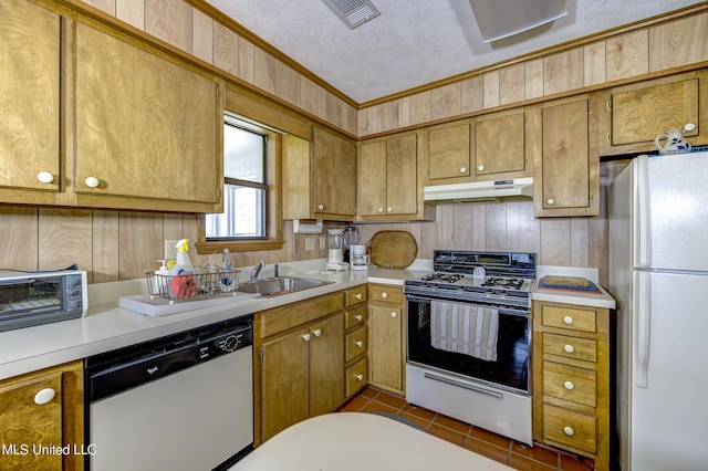 121 Belle Island Dr, Vicksburg, MS 39183 - kitchen with a sink, light countertops, under cabinet range hood, ornamental molding, and white appliances