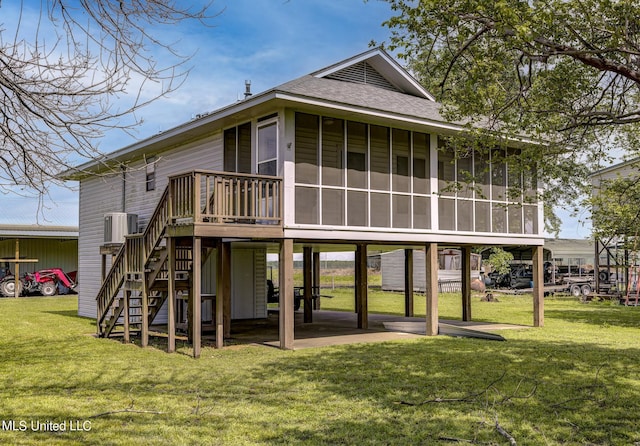 121 Belle Island Dr, Vicksburg, MS 39183 - back of property with a sunroom, a lawn, a shingled roof, and stairway