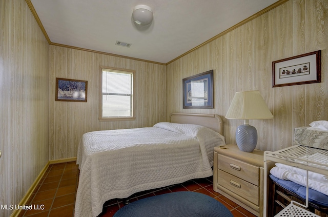 tiled bedroom featuring crown molding