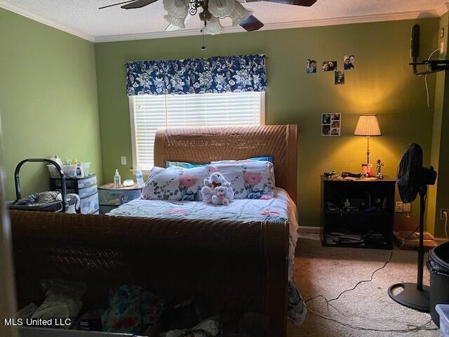 carpeted bedroom with ornamental molding, a textured ceiling, and ceiling fan