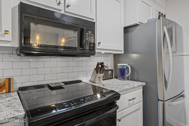 821 Planters Point Dr, Canton, MS 39046 - kitchen featuring black appliances, decorative backsplash, white cabinets, and light stone counters