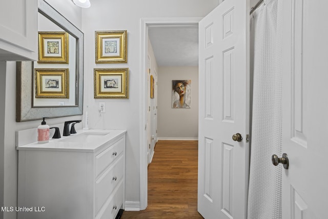821 Planters Point Dr, Canton, MS 39046 - hallway featuring a sink and dark wood-type flooring