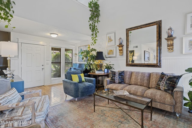 821 Planters Point Dr, Canton, MS 39046 - living room featuring wood finished floors and a wainscoted wall
