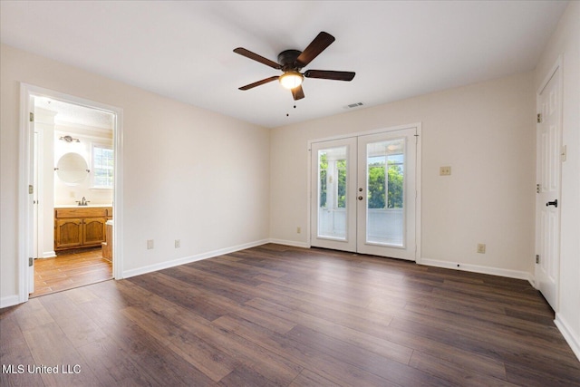 2185 Plum Point Rd, Southaven, MS 38672 - unfurnished bedroom featuring access to outside, dark wood-style flooring, french doors, baseboards, and ensuite bathroom