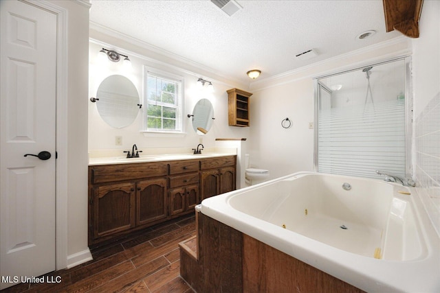 2185 Plum Point Rd, Southaven, MS 38672 - bathroom featuring a tub with jets, crown molding, double vanity, wood tiled floors, and a shower with door