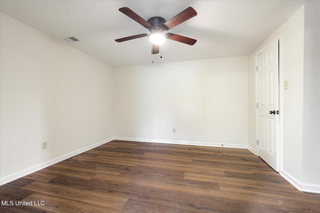 2185 Plum Point Rd, Southaven, MS 38672 - spare room featuring a ceiling fan, dark wood-style flooring, and baseboards