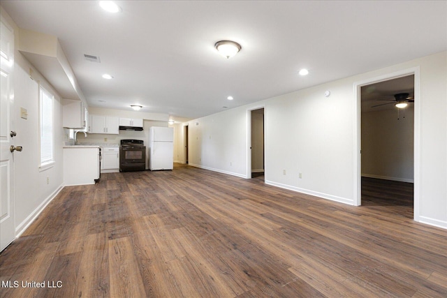 2185 Plum Point Rd, Southaven, MS 38672 - unfurnished living room with baseboards, dark wood-type flooring, recessed lighting, and ceiling fan
